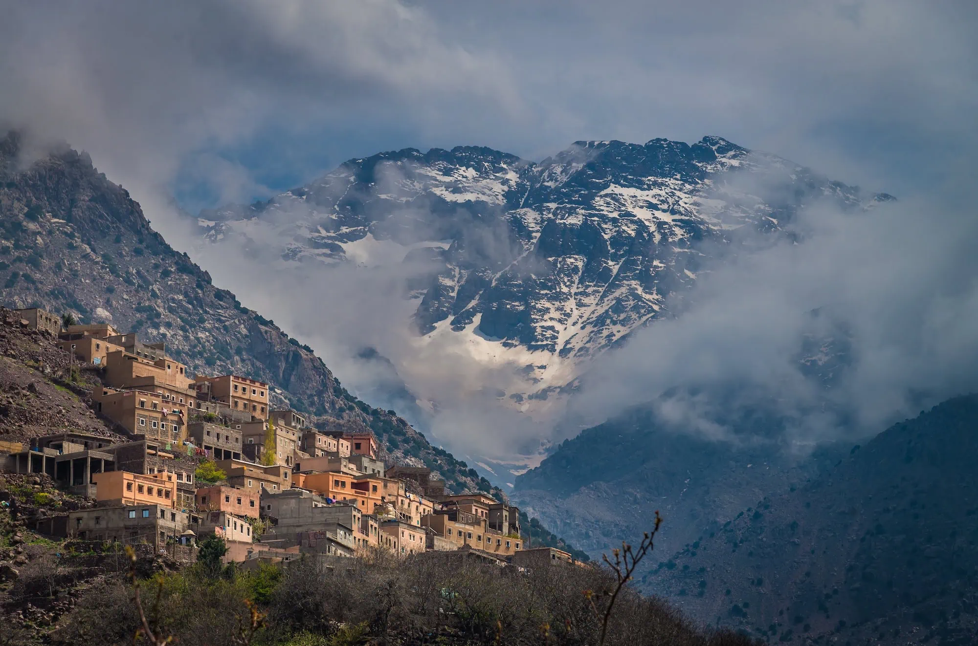 Traditional Berber mountain village with earthen buildings in Atlas Mountains