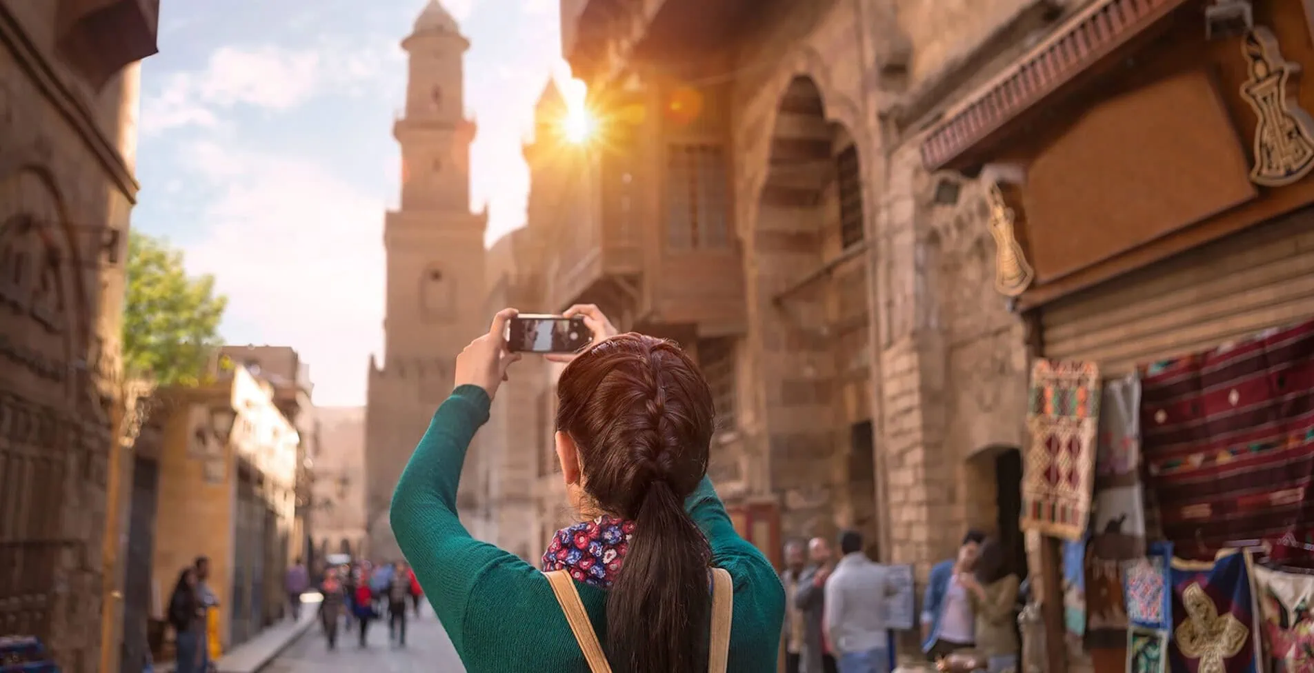A young girl takes pictures in one of the neighborhoods of Cairo Egypt
