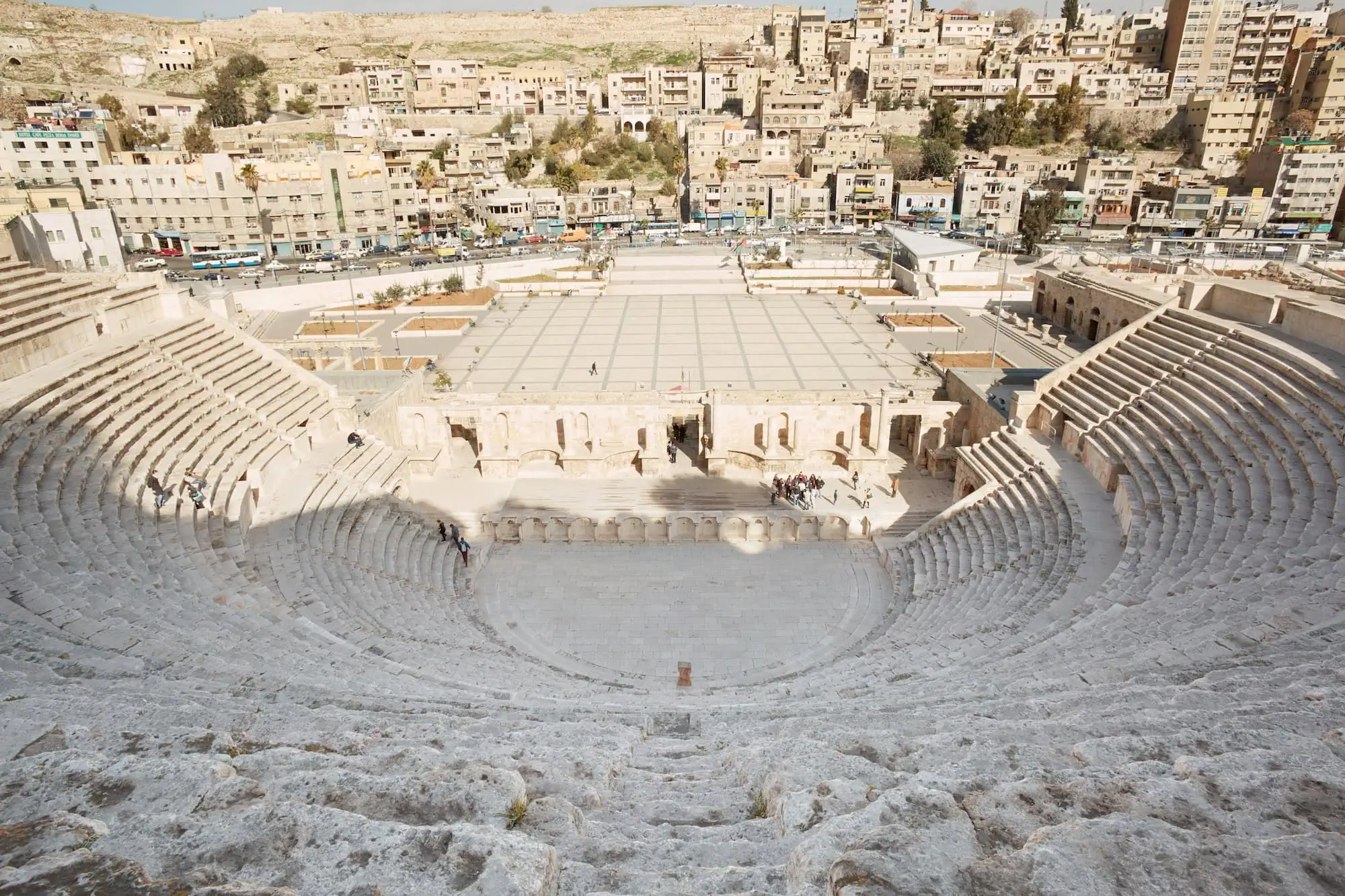 Aerial view of ancient Roman amphitheater in Amman with stone seating tiers