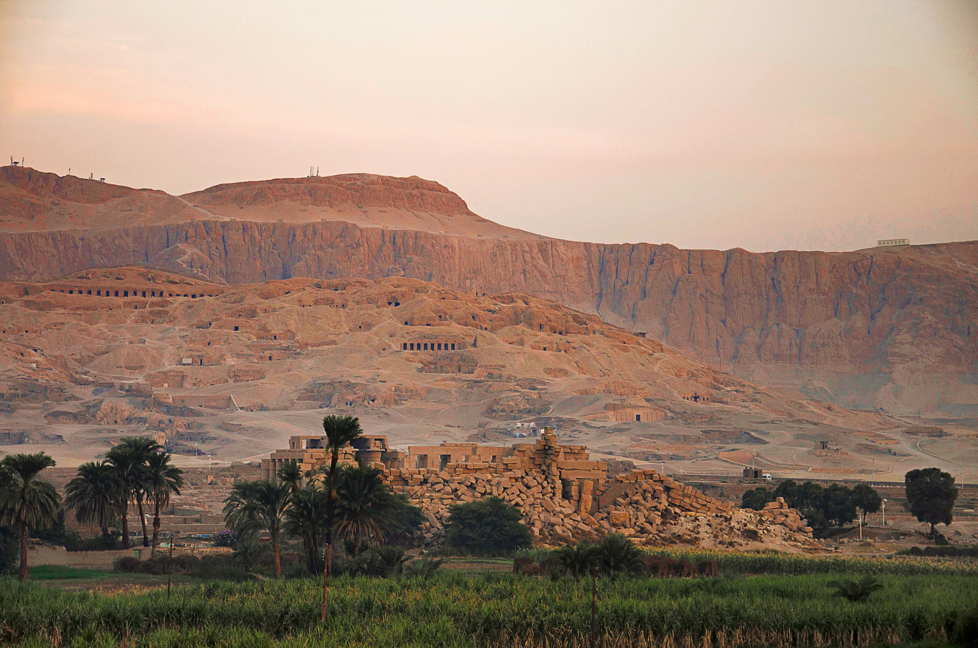 Valley of the Kings landscape with desert cliffs and ancient ruins