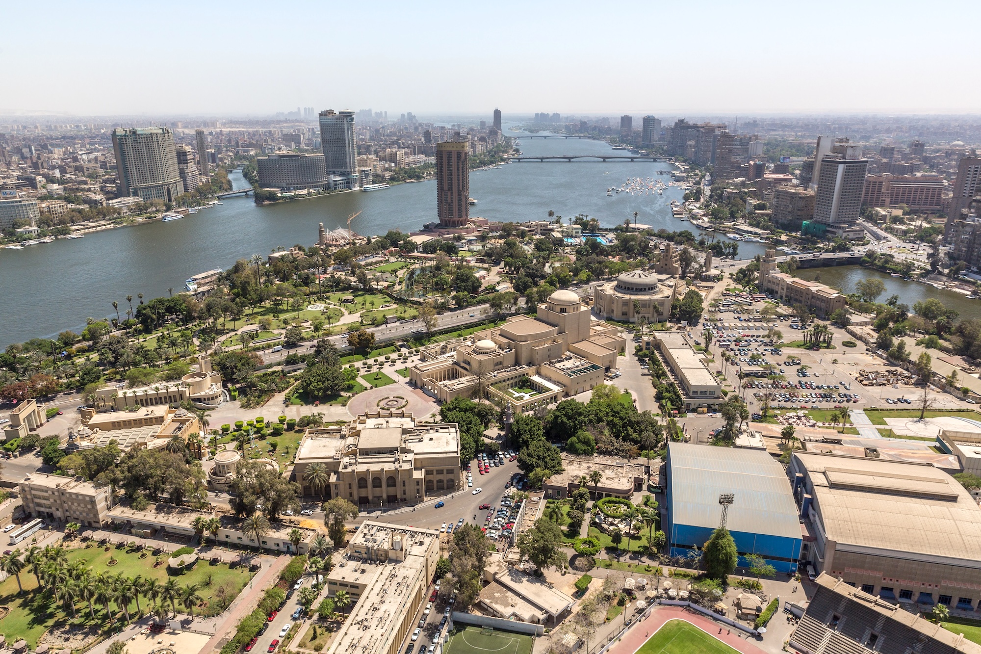 Aerial view of Cairo Opera House with surrounding cityscape and Nile River