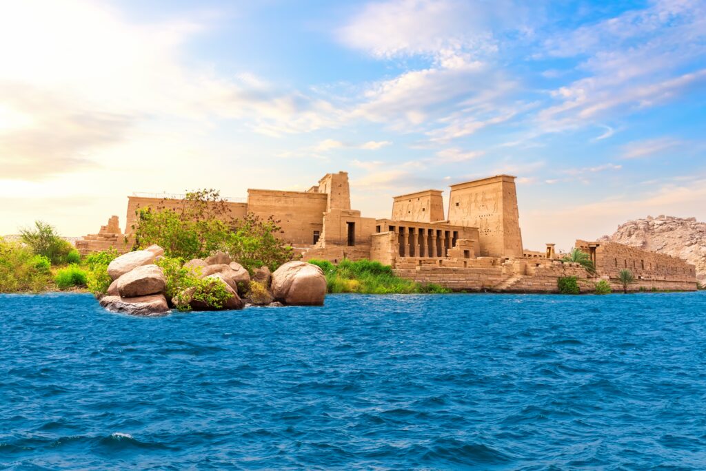 A scenic view of Philae Temple on Agilkia Island, surrounded by the Nile’s tranquil waters