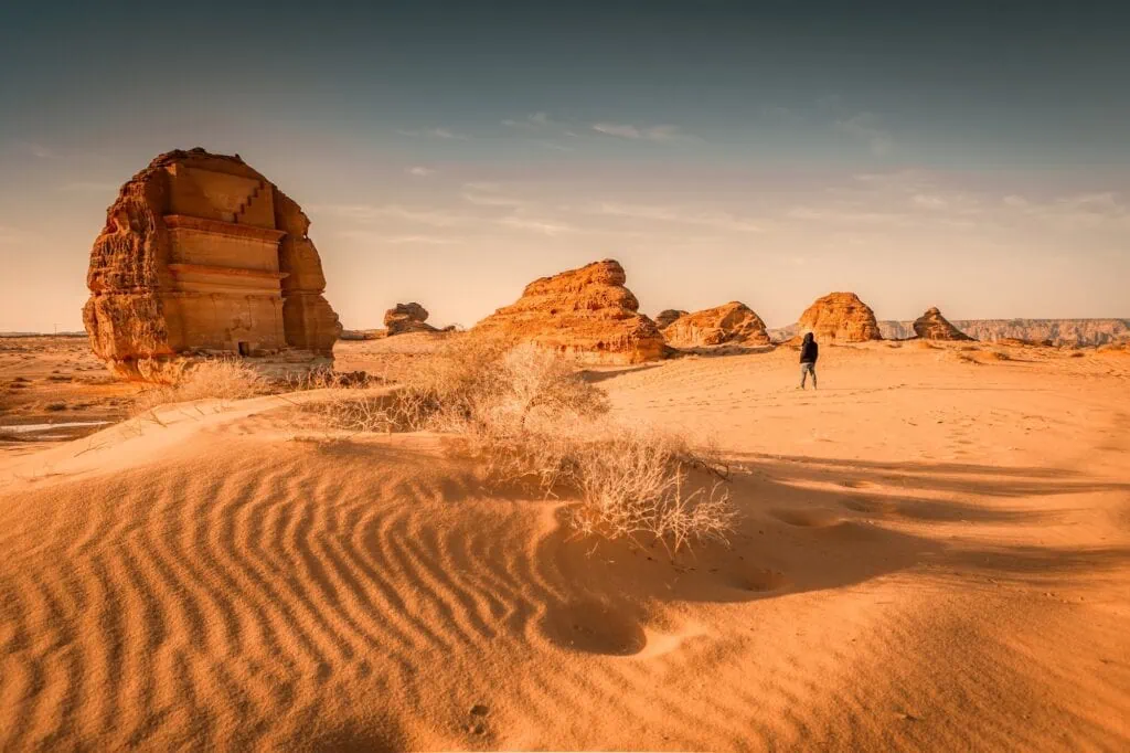 Qasr al-Farid (The Lonely Castle) at Hegra archaeological site in AlUla, Saudi Arabia — a Nabataean tomb facade carved into a free-standing sandstone monolith