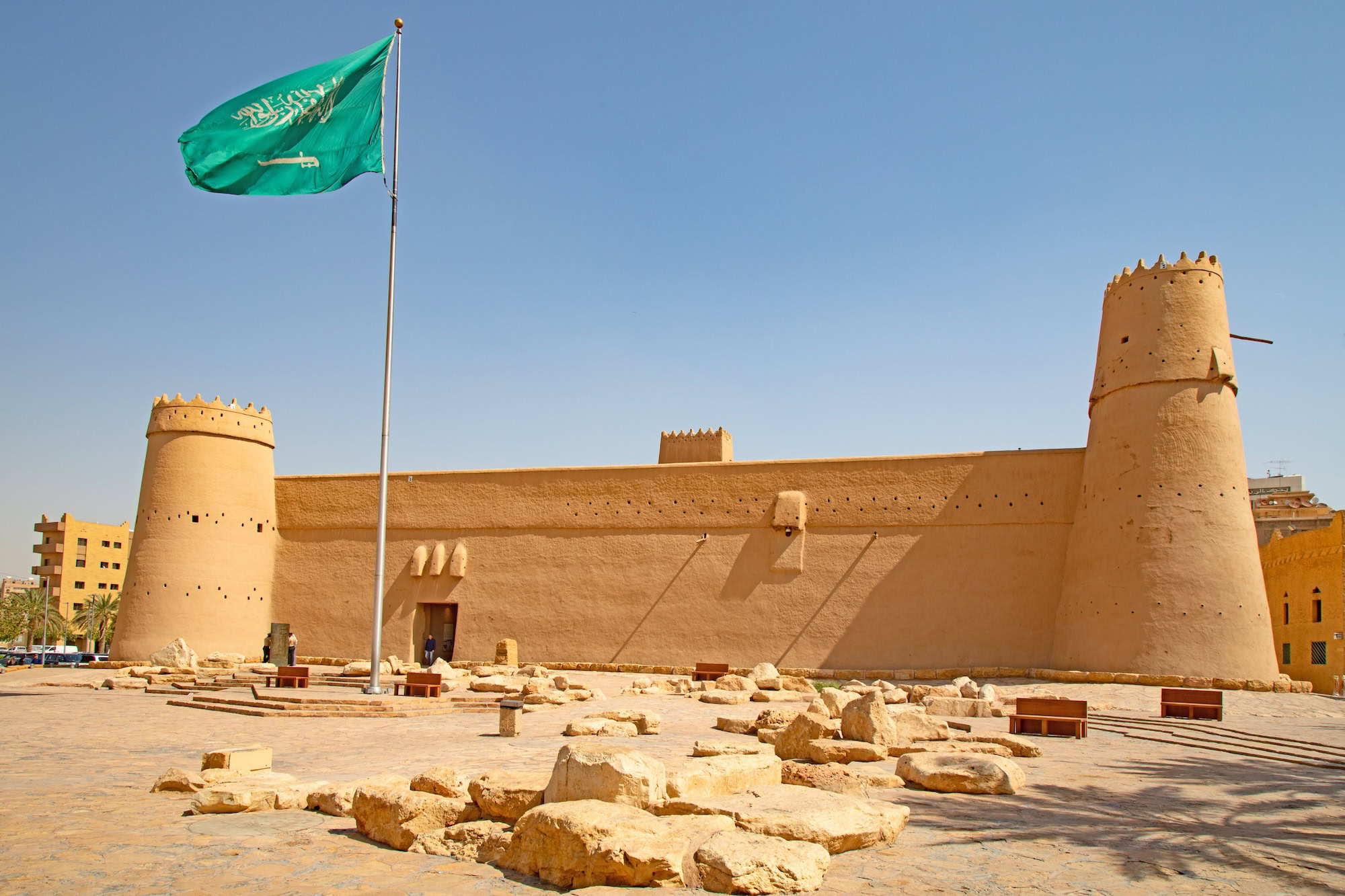Historic Masmak Fortress with Saudi flag and traditional stone architecture in Riyadh