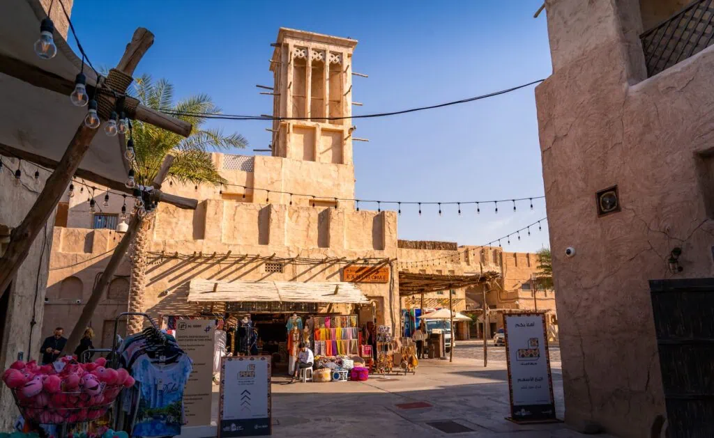 Al Seef Souk traditional-style waterfront shops and wooden boats along the creek Dubai