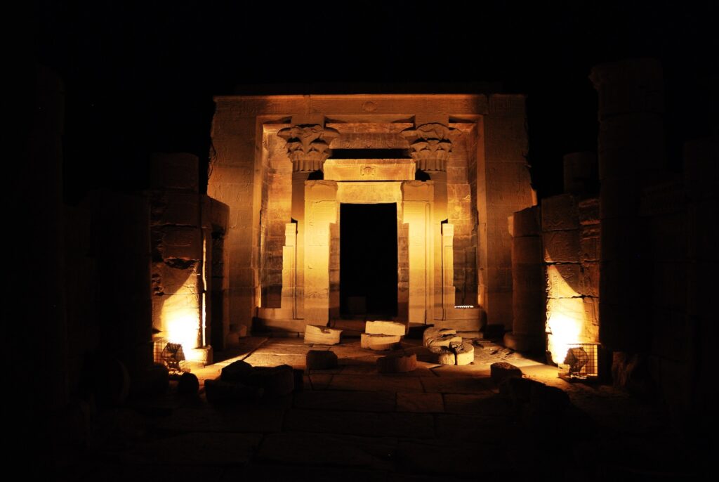 Ancient Egyptian hieroglyphs on the wall of the temple of the island of Fillet. Photo taken during a trip to Africa on vacation. Night light show in the temple of the island Philae