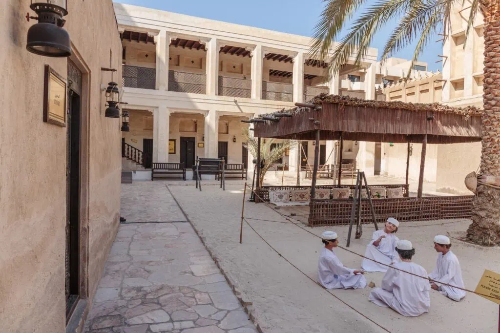 Ancient Islamic School building with traditional courtyard and wind towers, Heritage Village Dubai