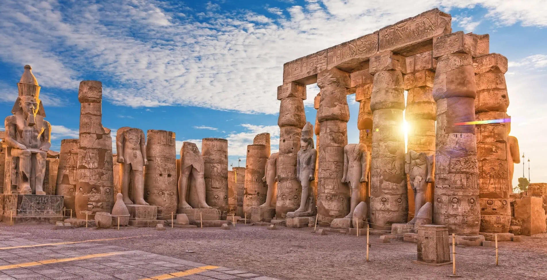 Ancient Luxor Temple Standing Ramses II statues First pylon ruins Egypt 1905x976 crop 50 58