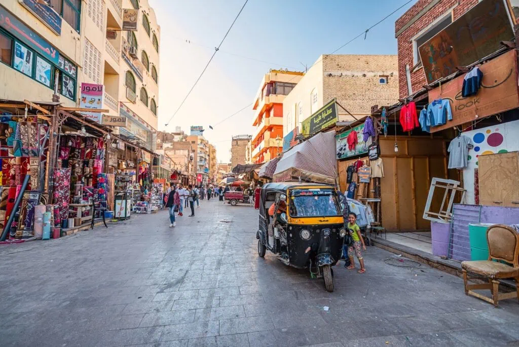 Chaotic evening traffic with tuk-tuk in southern Egypt