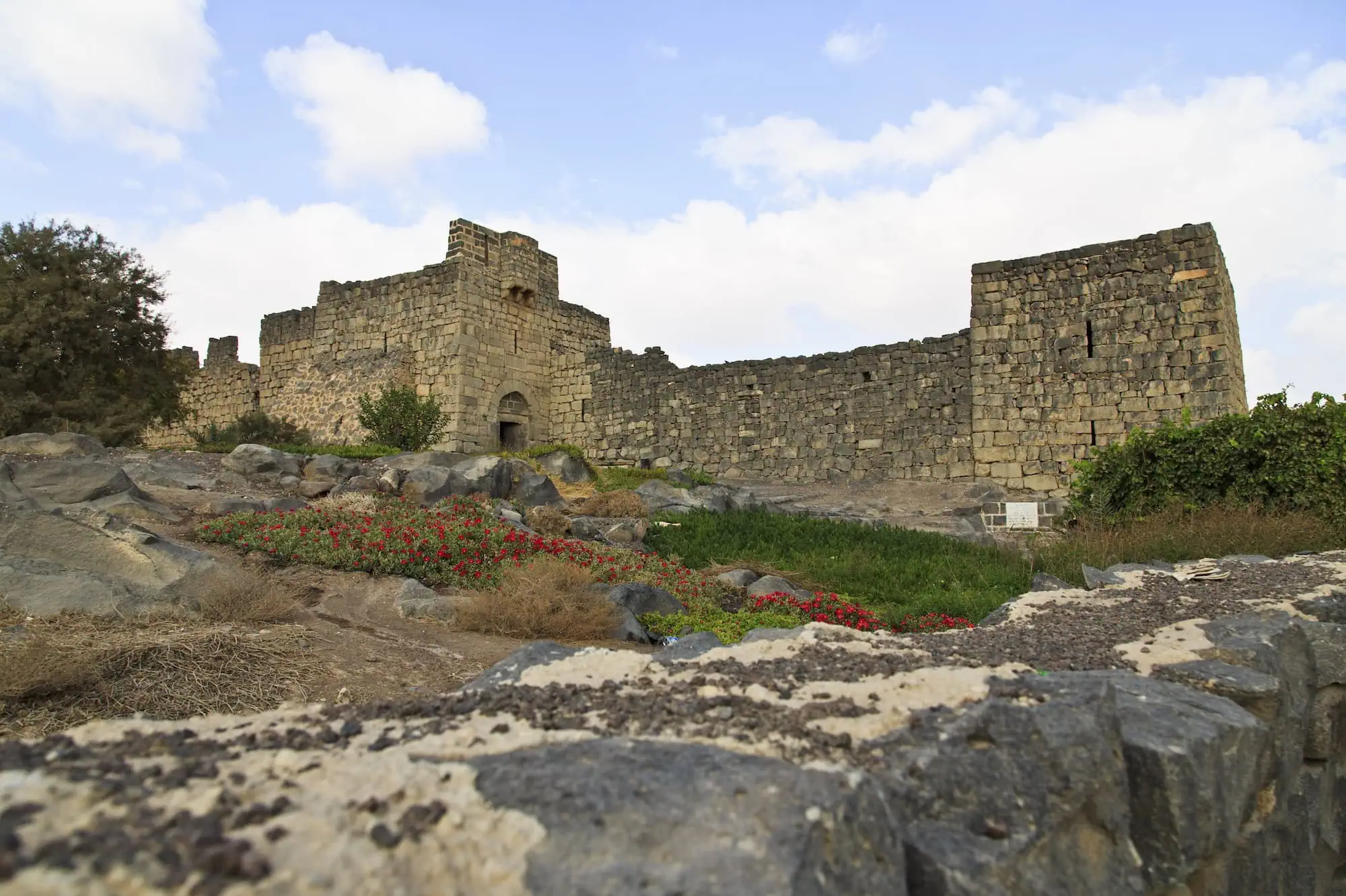 Ancient stone fortress ruins of Azraq Castle with dark basalt walls