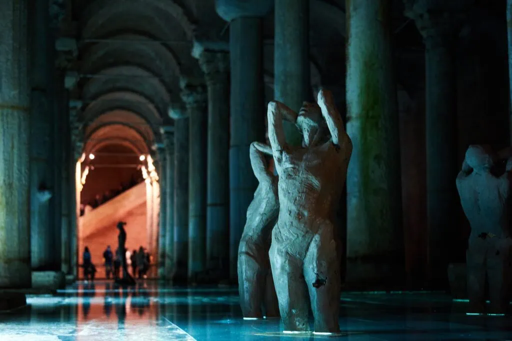 Marble statues aligned along a columned hallway in Basilica Cistern Istanbul