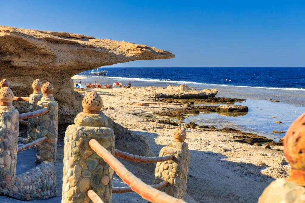 Red Sea coastline with clear water and rocky shoreline along the coast, Marsa Alam