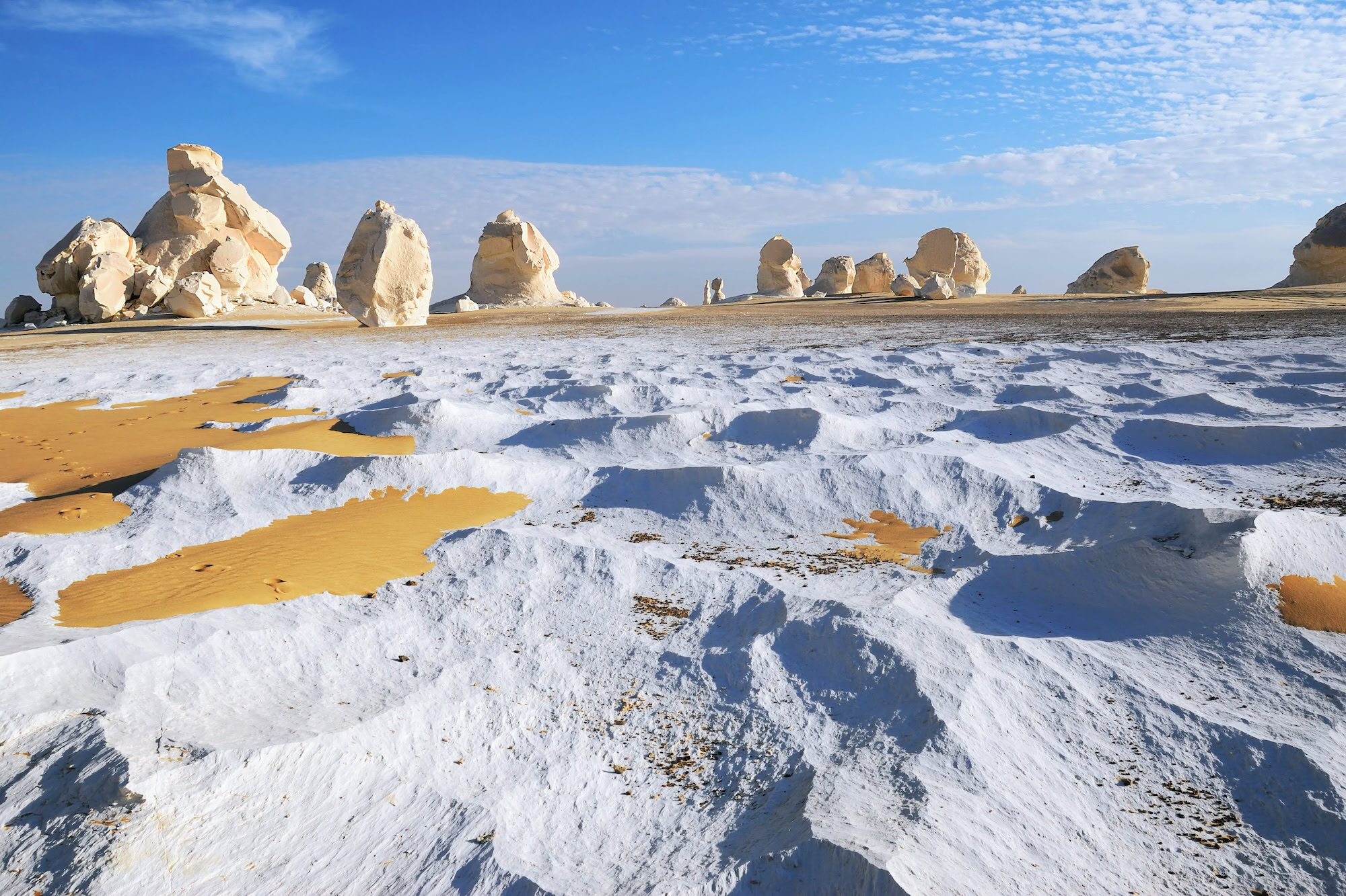 Surreal white chalk and limestone rock formations in Egypt's White Desert