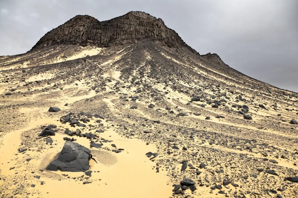 Black desert rock formation in the Valley of El Haiz, Bahariya Oasis