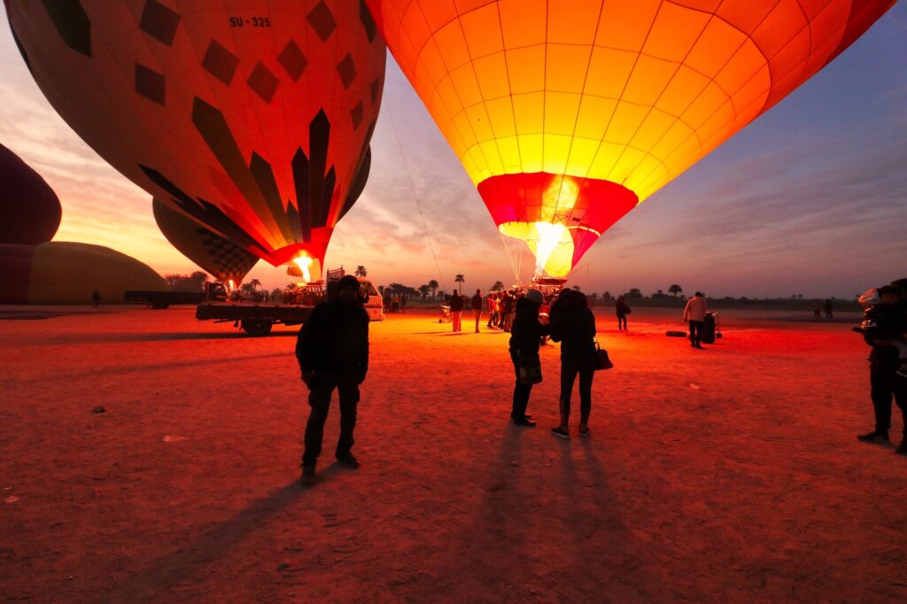 Blasts of flames from propane burners fill safari balloons with hot air for joyrides over the world famous ancient egyptian sites over LuxorEgypt