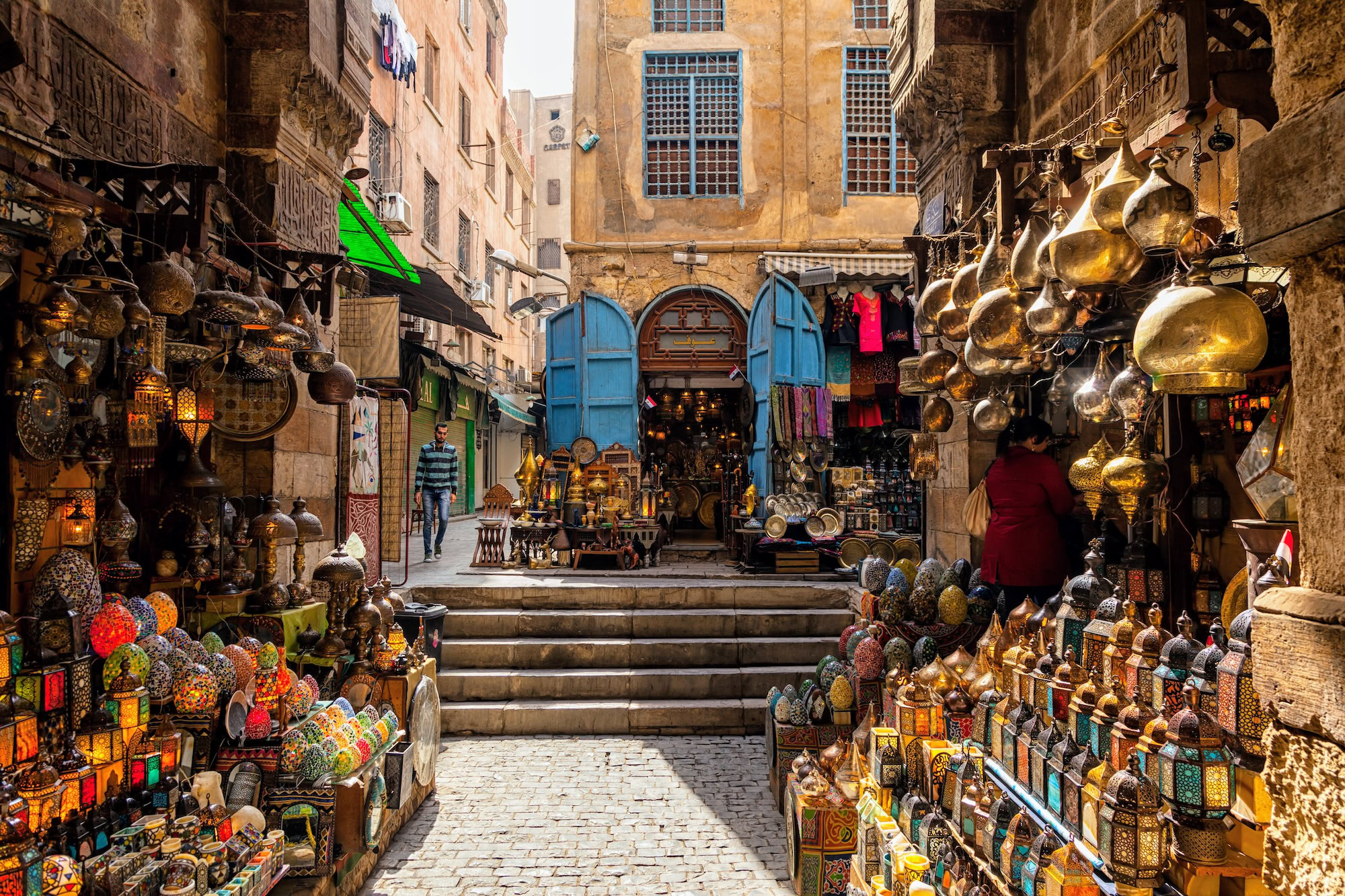 Traditional Khan el-Khalili Bazaar with colorful lanterns, pottery, and handicrafts displayed on stone steps