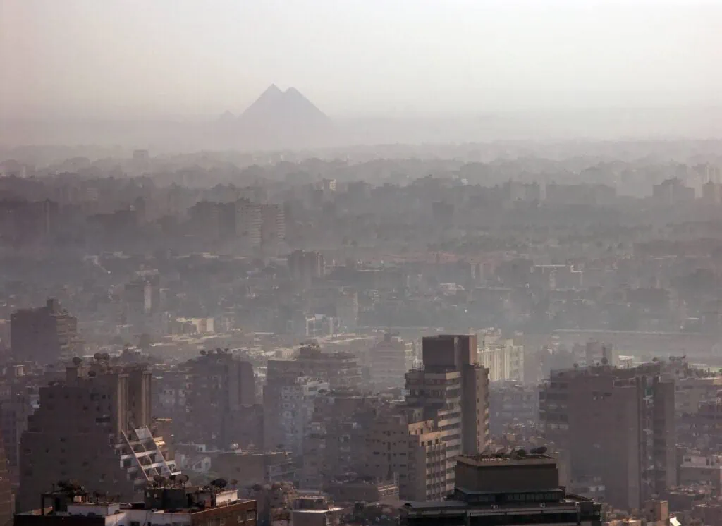 Cairo city skyline with the Pyramids of Giza on the horizon