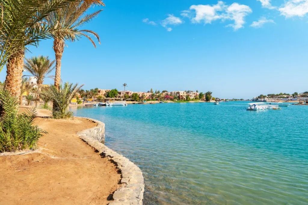 Canal lined with boats and colorful houses in El Gouna