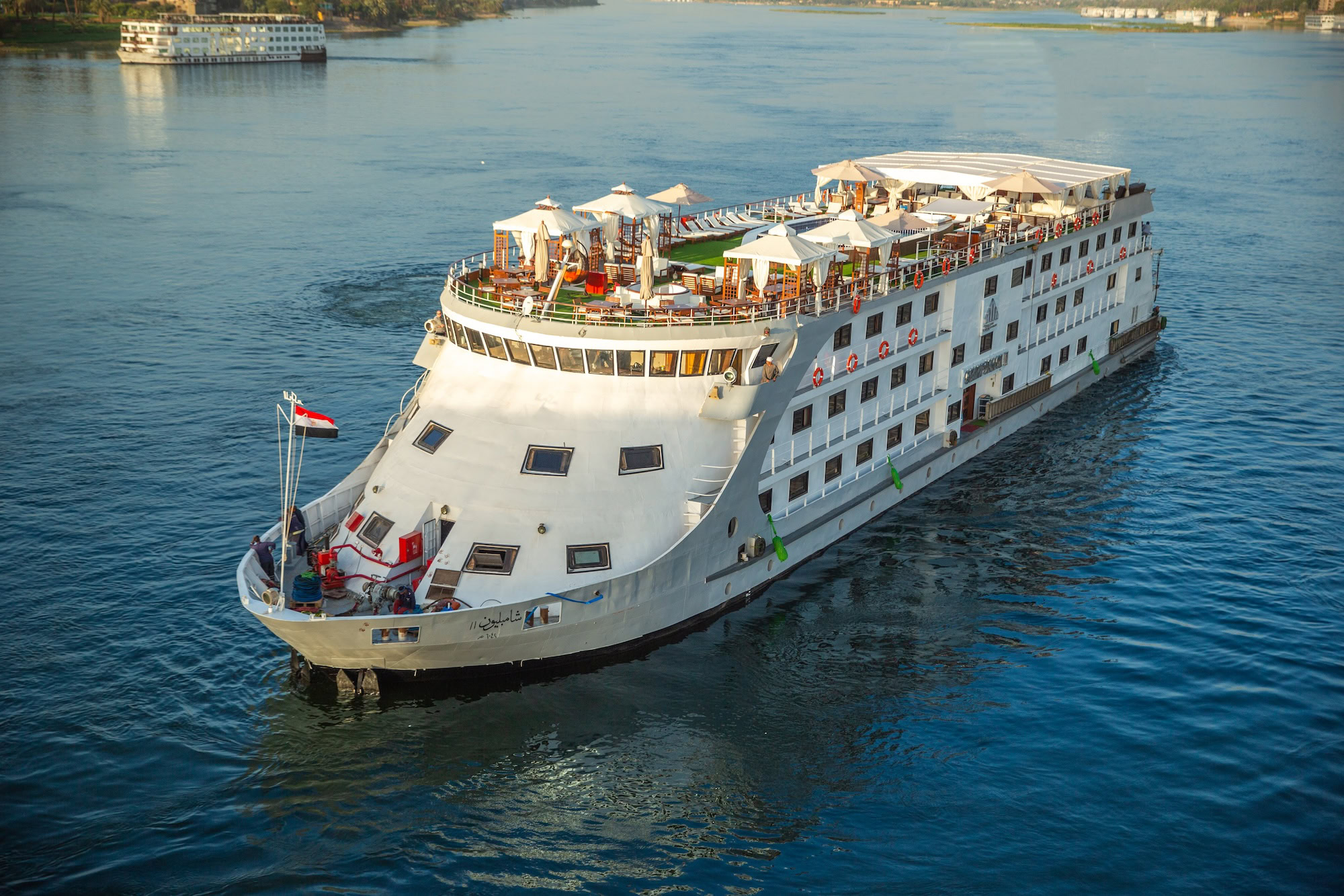Aerial view of Nile River cruise ship with multiple decks and facilities