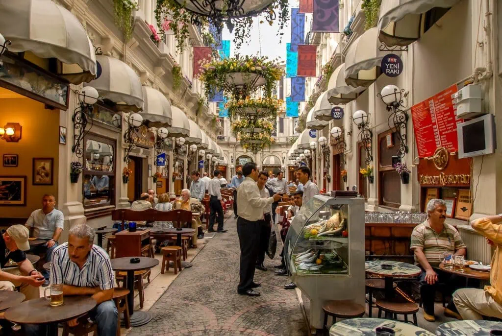 Cite de Pera passage with arched glass roof and storefronts along Istiklal Avenue, Istanbul