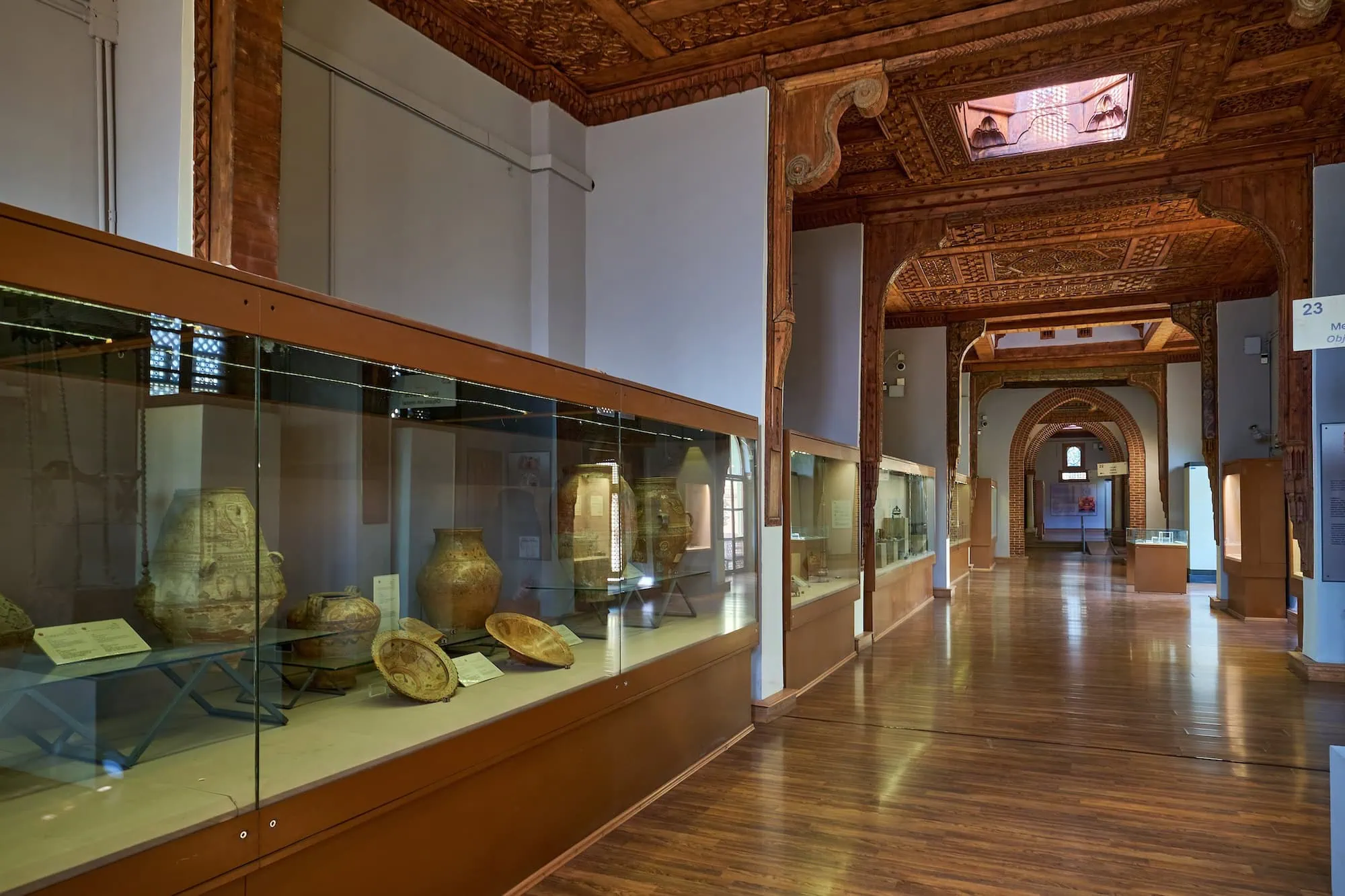 Interior of Coptic Museum displaying ancient Christian artifacts in glass cases