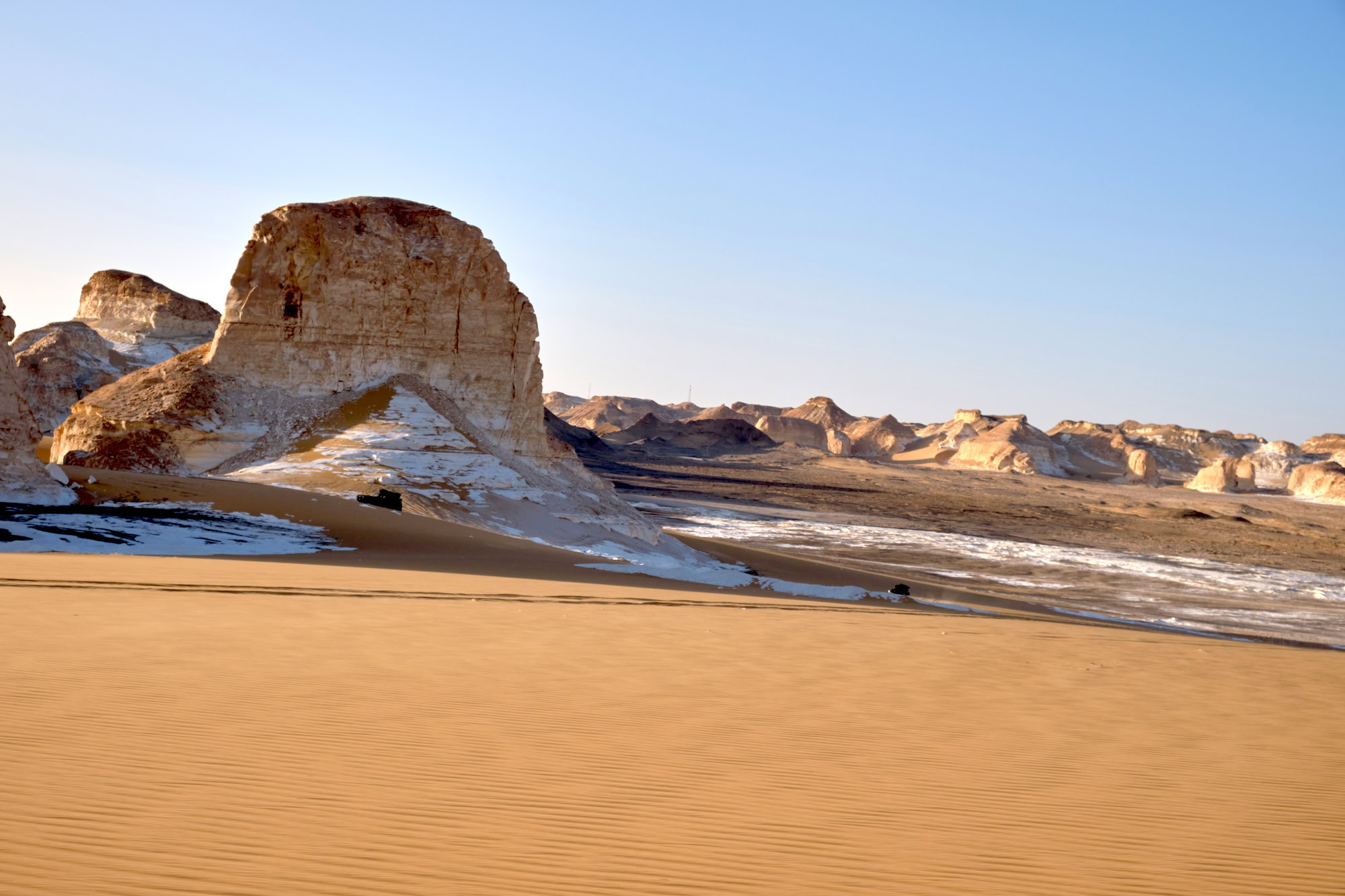 White chalk formations and sand dunes in Egypt's White Desert