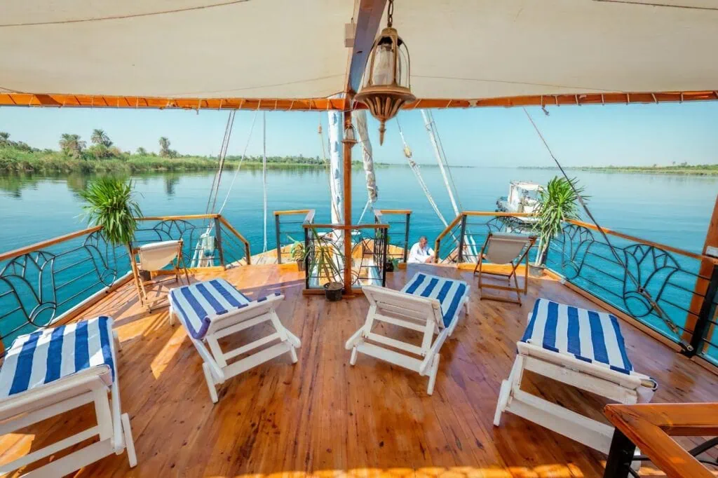 View of the Nile River from the deck of a Dahabiya Nile Cruise in Aswan, Egypt — the southern endpoint of standard 4-day Luxor–Aswan cruise itineraries
