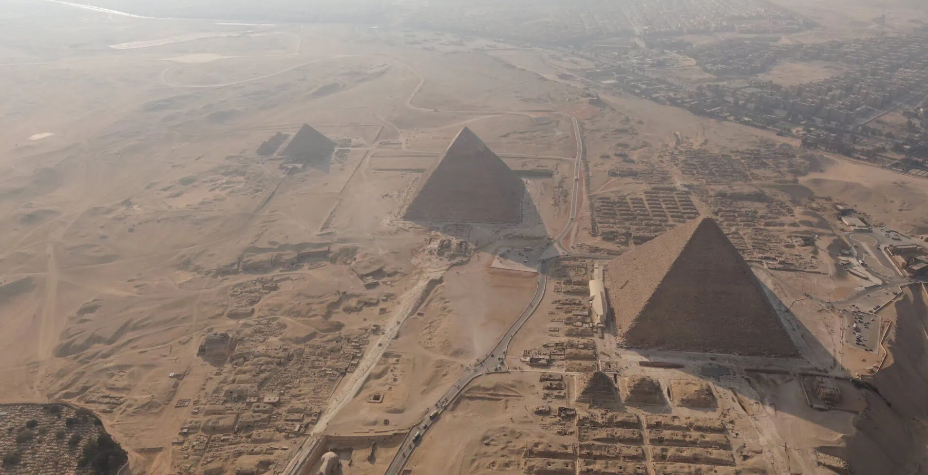 Dark hazy Giza Pyramids and the Sphinx aerial view