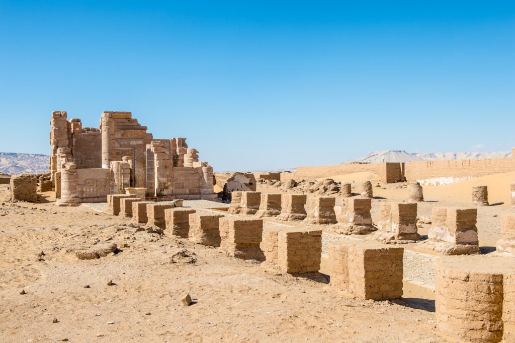 Deir el-Haggar Temple standing in the desert landscape of Dakhla Oasis