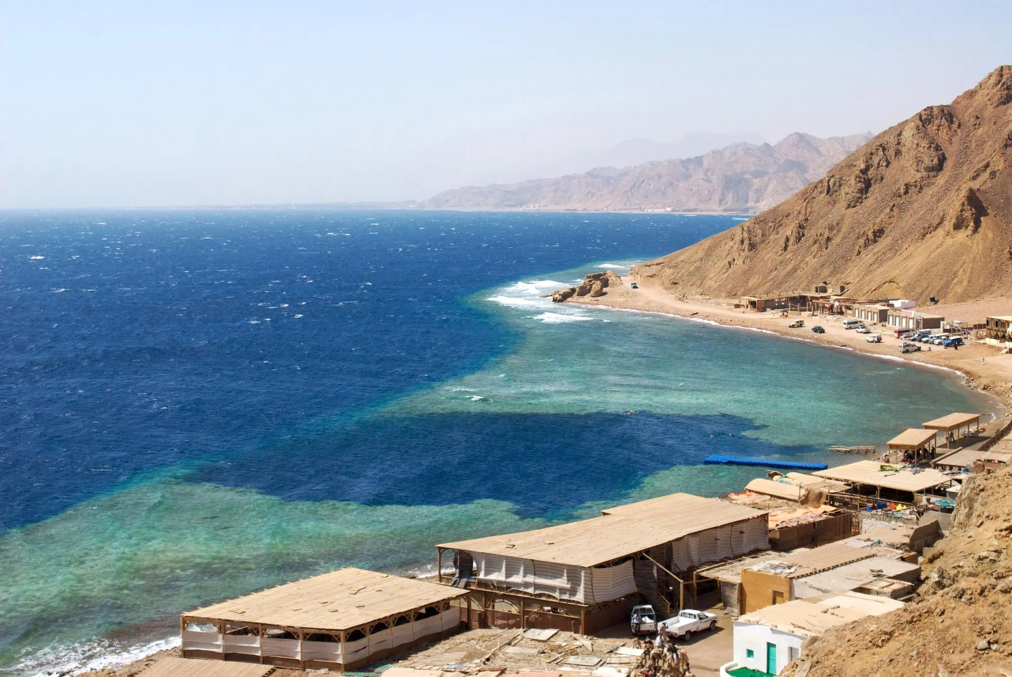Red Sea coastline showing the famous Blue Hole diving site with cliffs and clear waters