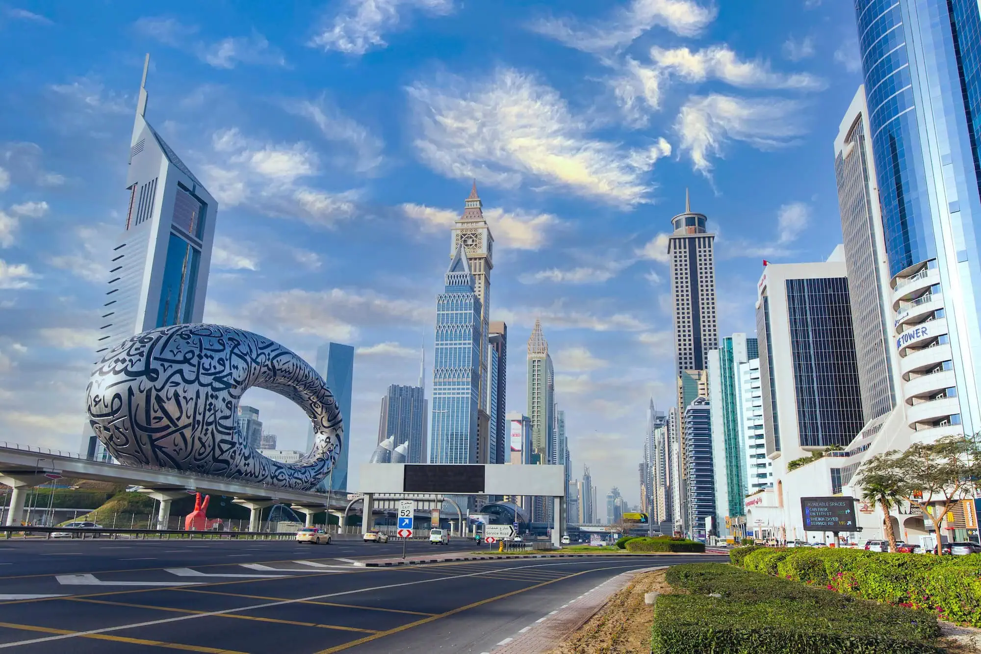 Dubai's futuristic Museum of the Future with distinctive torus-shaped architecture among modern skyscrapers