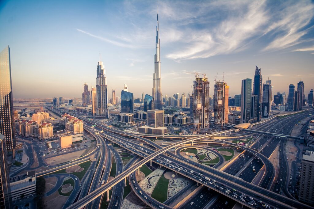 The Dubai skyline glowing above the city’s most vibrant traffic corridor