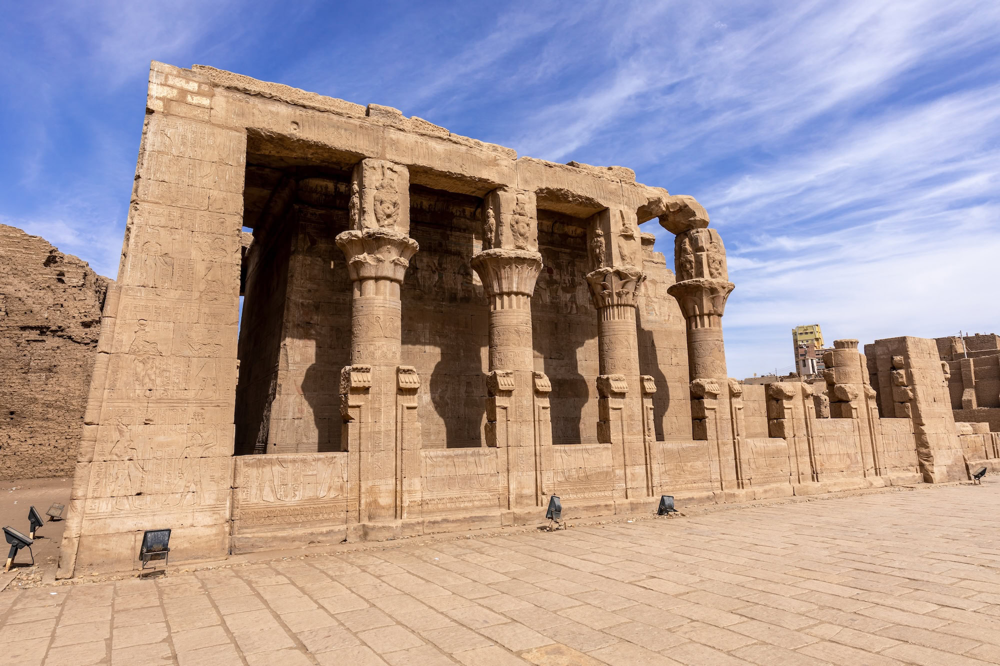 Ancient Temple of Edfu with stone columns, hieroglyphs, and sandstone courtyard