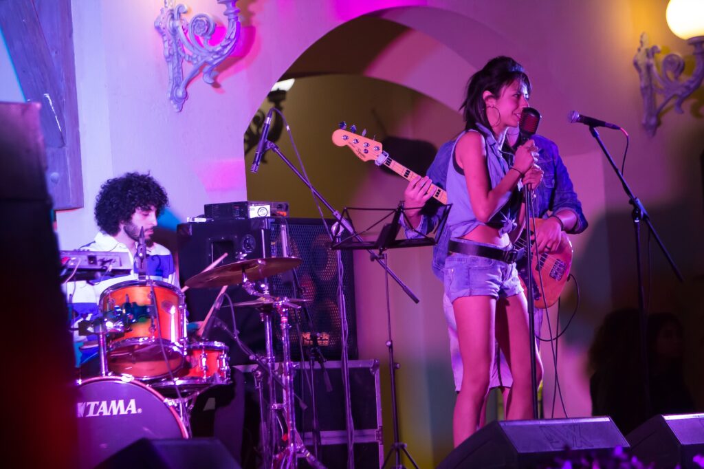 Local band performing on a lit stage inside a Hurghada nightclub