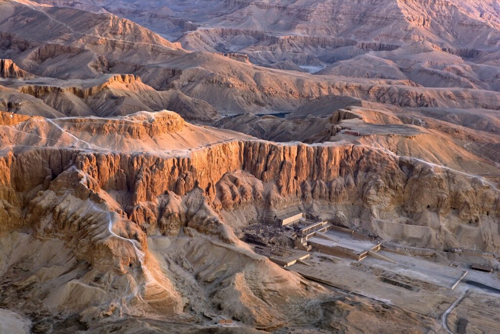Aerial view over Luxor’s West Bank showing Deir el-Bahari and the Mortuary Temple of Hatshepsut – a breathtaking highlight on Egypt tours from Las Vegas.
