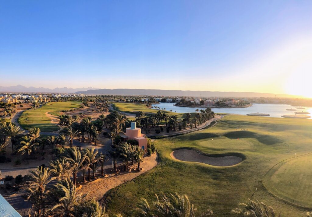 Golf course with green fairways and lagoons in El Gouna