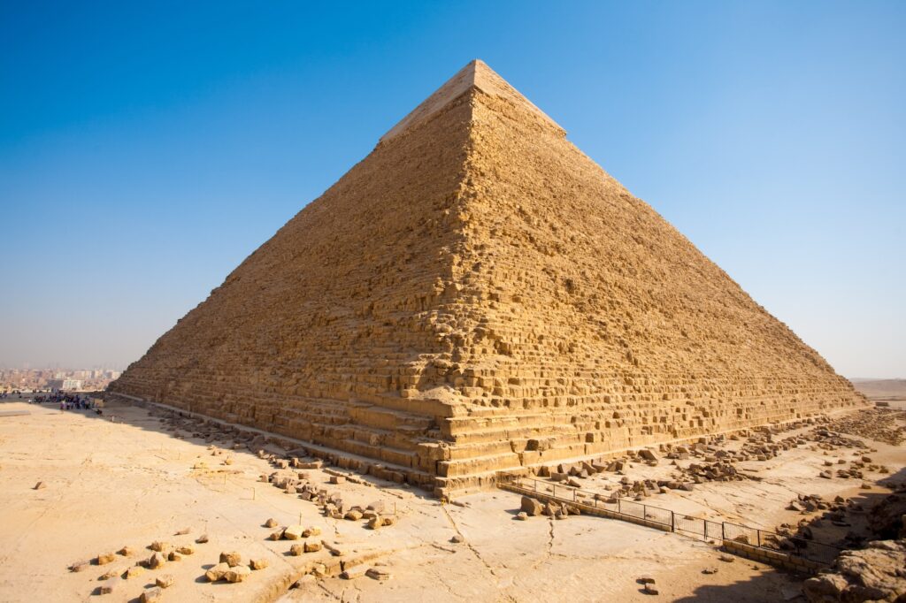 Elevated perspective of the corners of the Great Pyramid of Khafre the largest of Egyptian pyramids seen from rear with a clear blue sky. Horizontal copy space