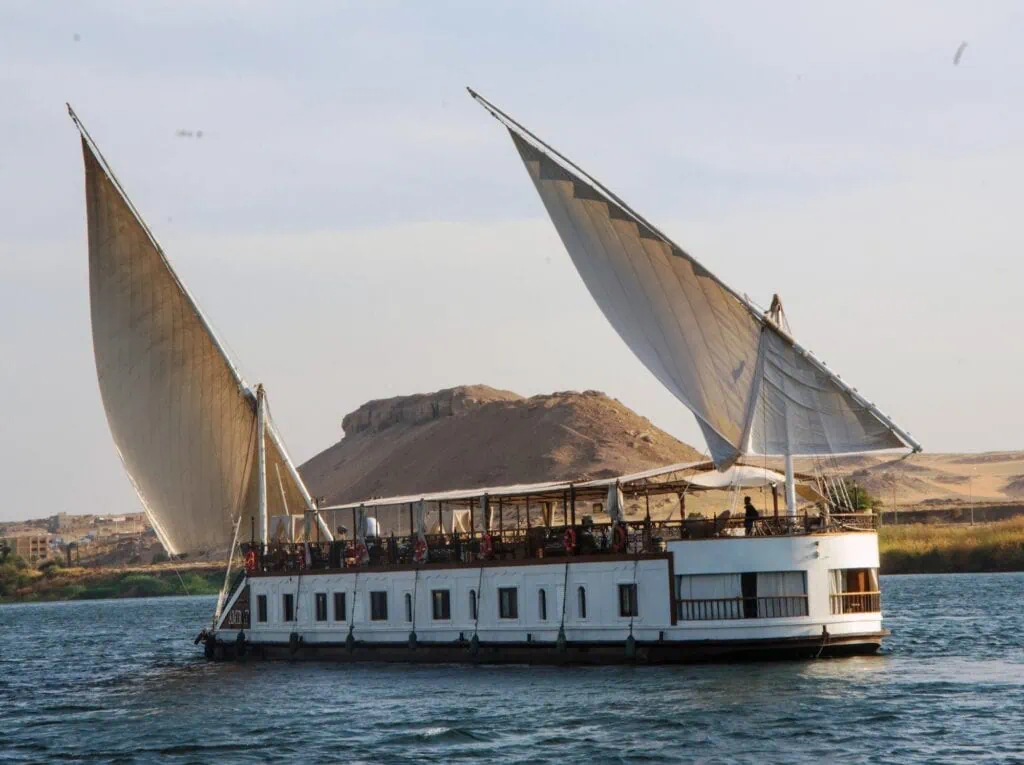 Exterior view of the Sonesta Amirat Dahabeya with traditional design sailing on the Nile River, Luxor