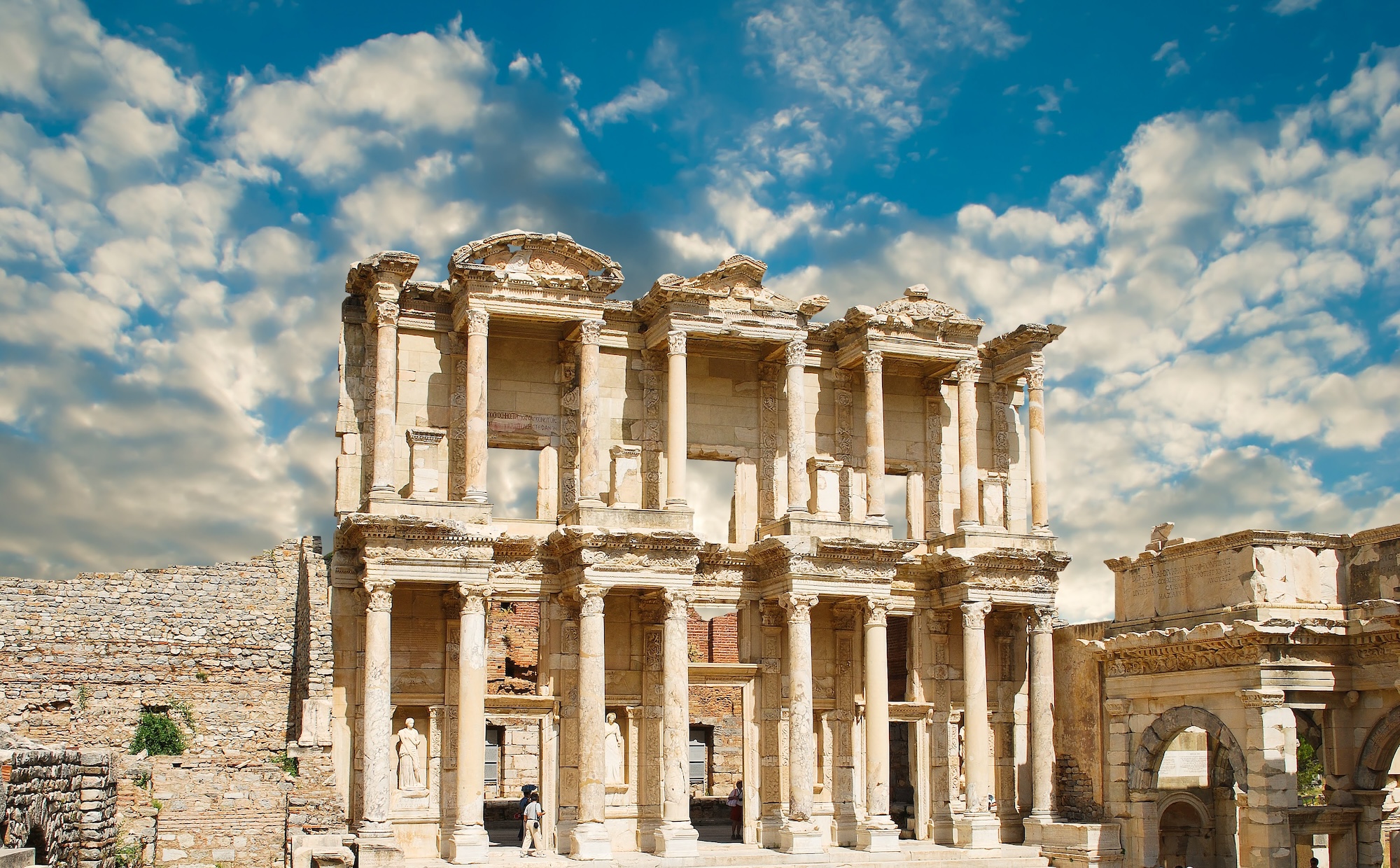 The Library of Celsus facade at Ephesus archaeological site, Turkey — 2nd-century Roman library with Corinthian columns and ornate two-storey reconstructed facade, originally built between 114 and 117 AD