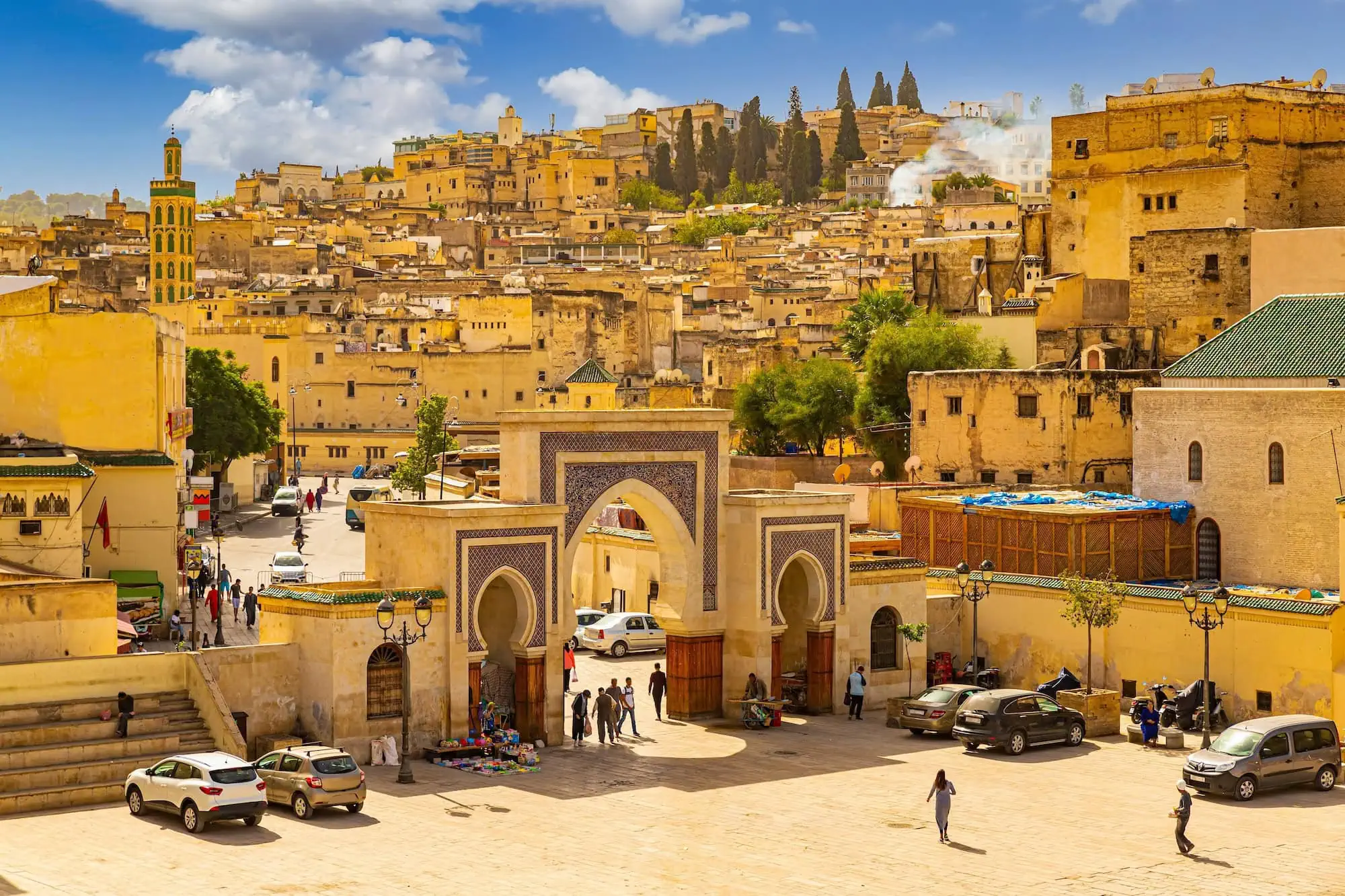 Panoramic view of historic Fez medina with traditional Islamic architecture and yellow buildings