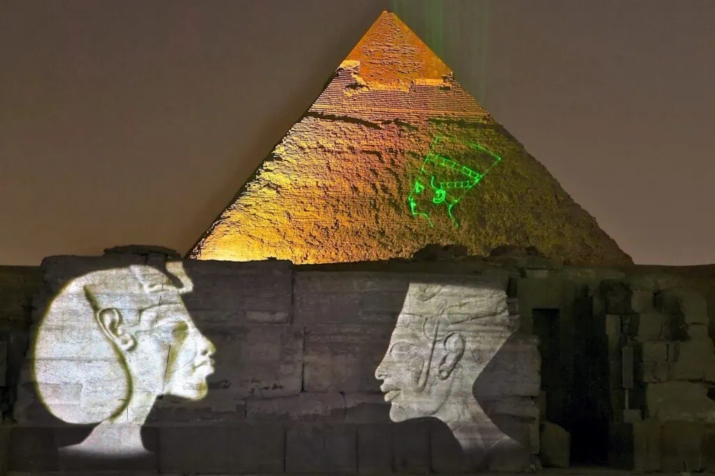Great Sphinx with the Pyramid of Khafre illuminated during the sound and light show on the Giza Plateau, Giza