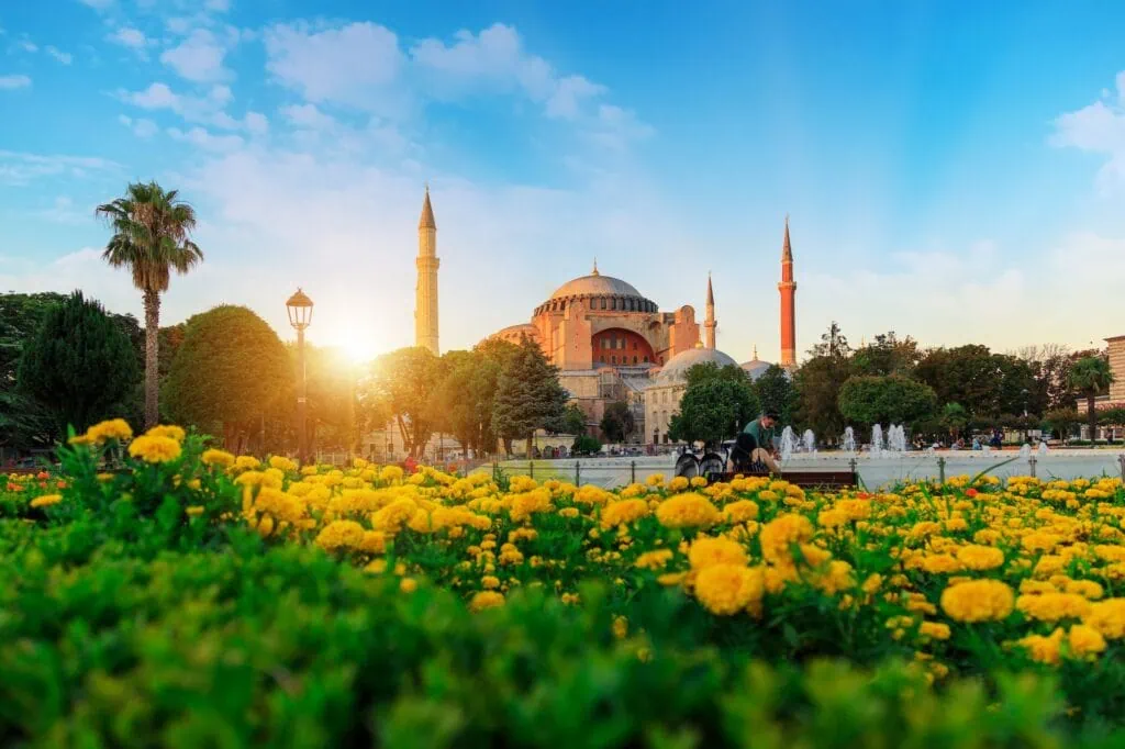 Hagia Sophia Mosque with domes and minarets under a cloudy summer sky, Istanbul