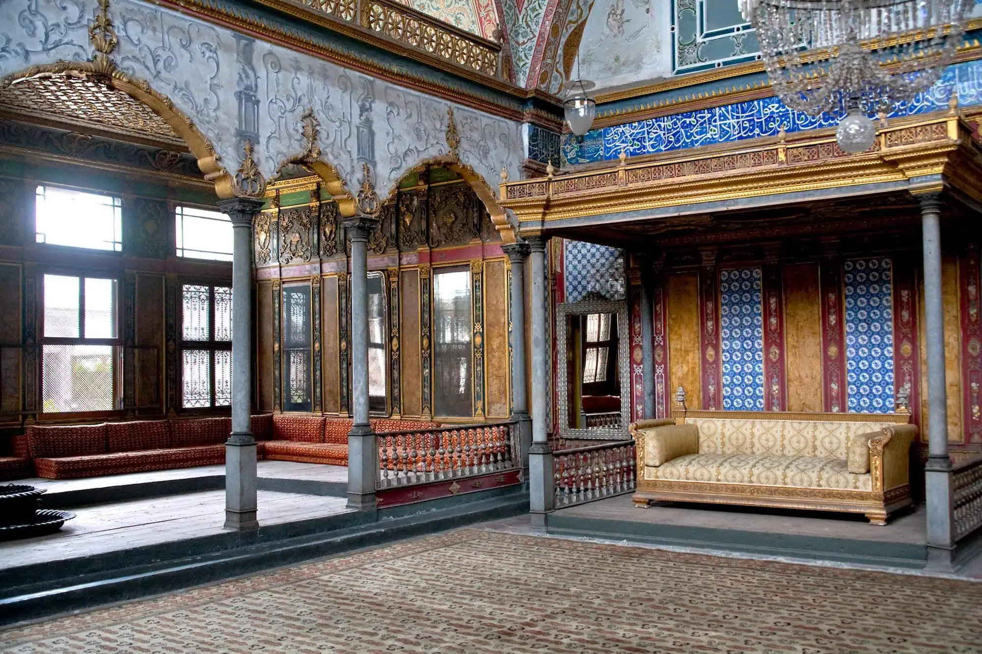Ornately decorated Ottoman interior room at Topkapi Palace with intricate tilework and golden details