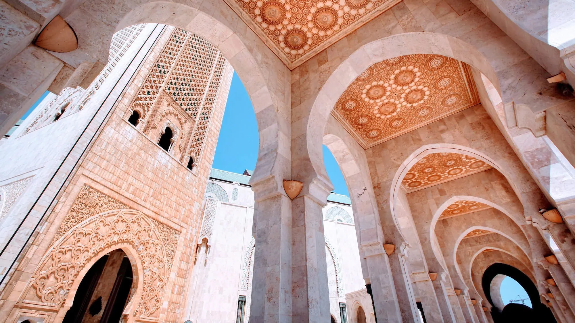 Interior view of Hassan II Mosque showing ornate Islamic arches, columns and geometric patterns