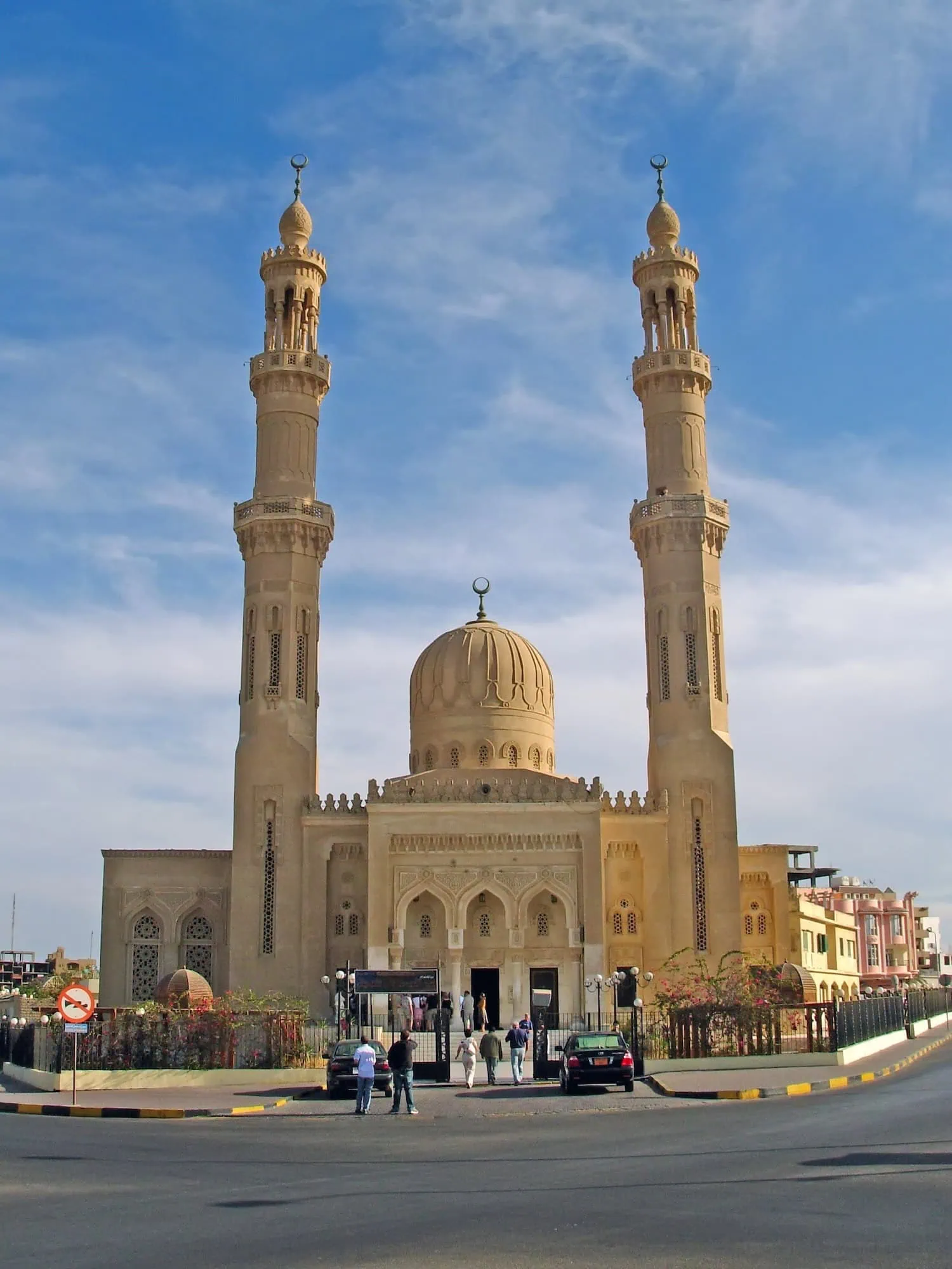 Islamic mosque in Egypt with minarets and dome representing religious practices