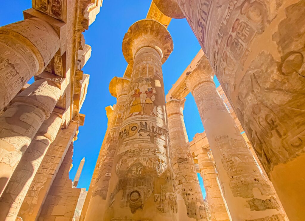 Karnak Temple is dedicated to the temple complex of Ancient Egypt in honor of the god Amun Ra his wife Mut and son Khons. Thebes Karnak Luxor Egypt. 2