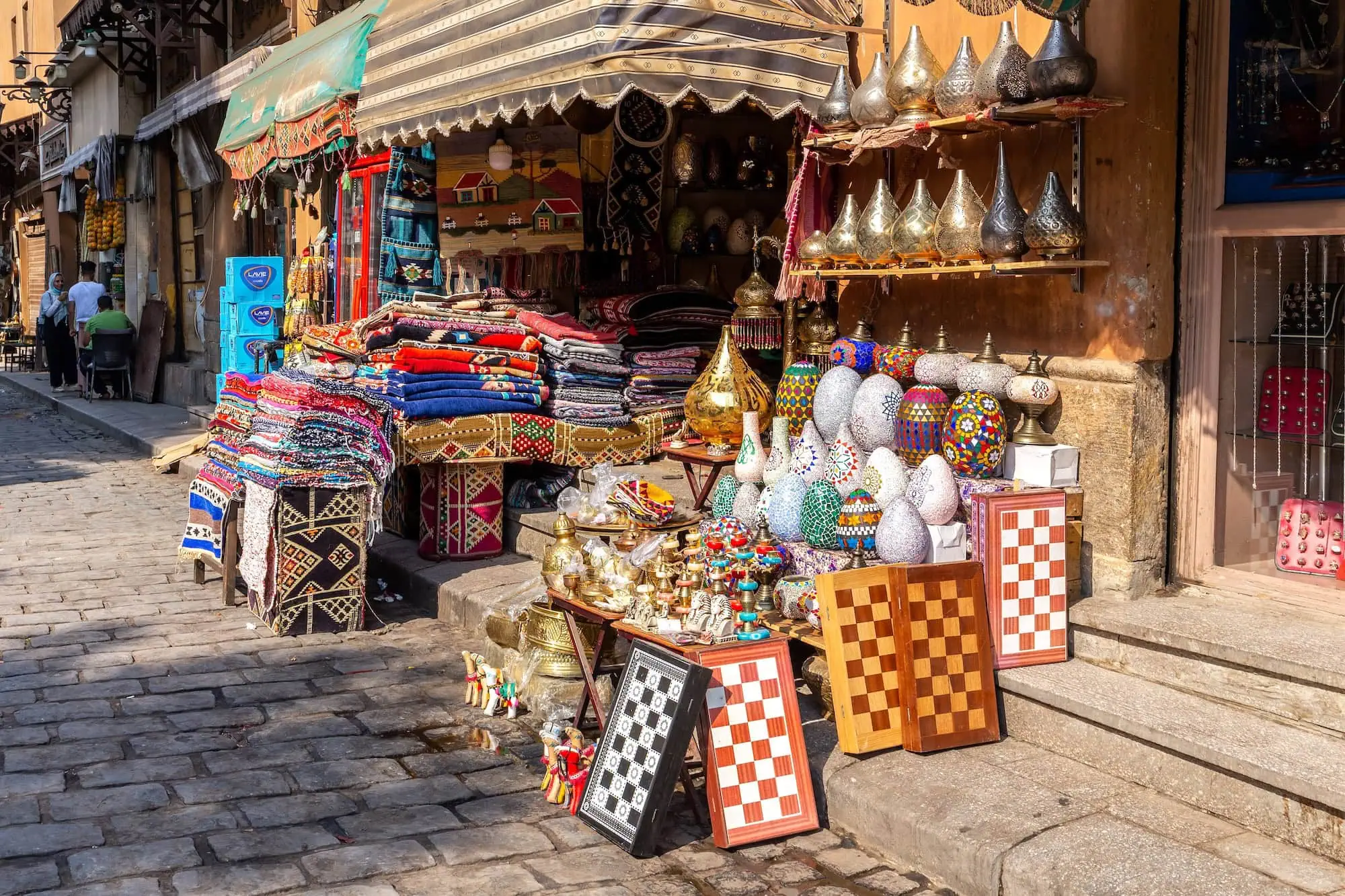Market stall at Khan el-Khalili bazaar displaying traditional Egyptian handicrafts and souvenirs