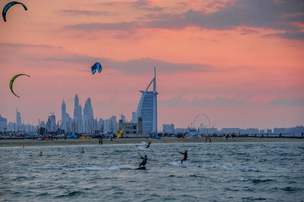 Kites flying above the shoreline at Kite Beach Jumeirah, Dubai