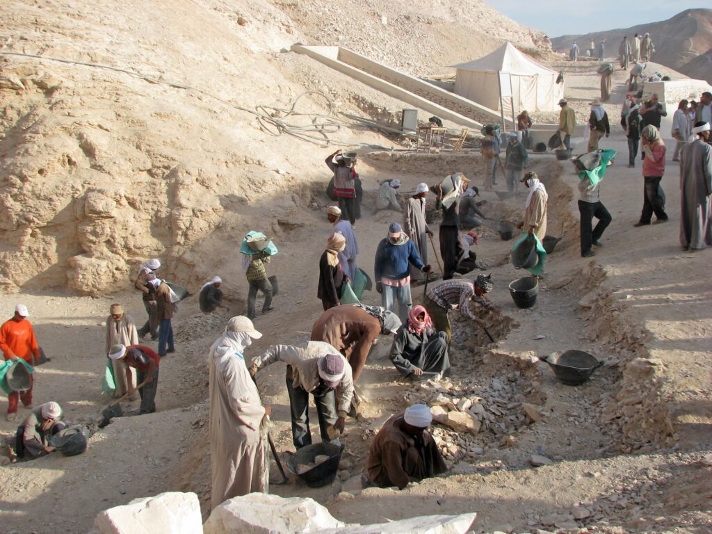 Workers sifting dirt and debris at an archaeological excavation site in the Valley of the Kings on the West Bank of the Nile, Luxor