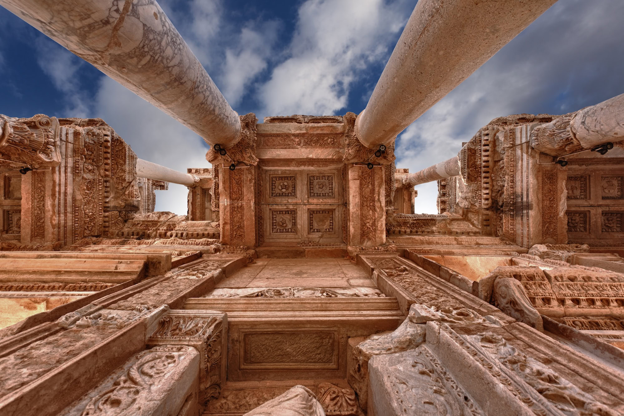 Interior view of ancient Library of Celsus ruins in Ephesus with ornate columns and stonework